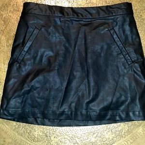 Black leather mini skirt.